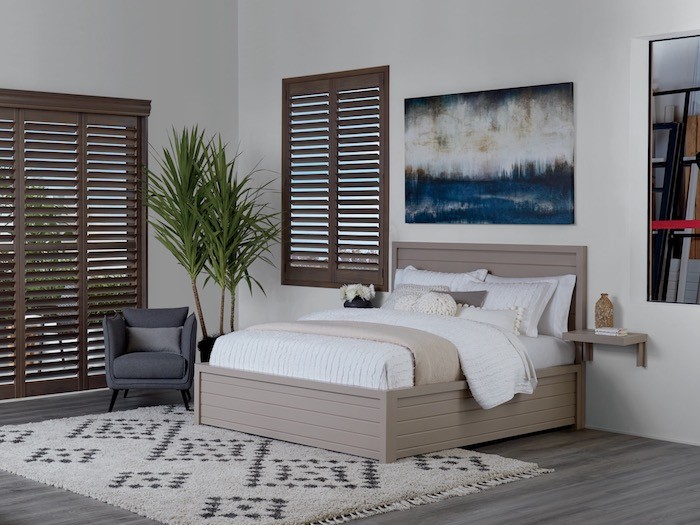 A tidy bedroom with made bed.